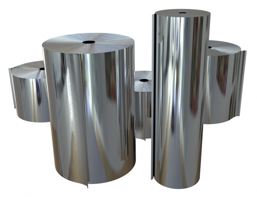 Rolls of metal foil isolated on white