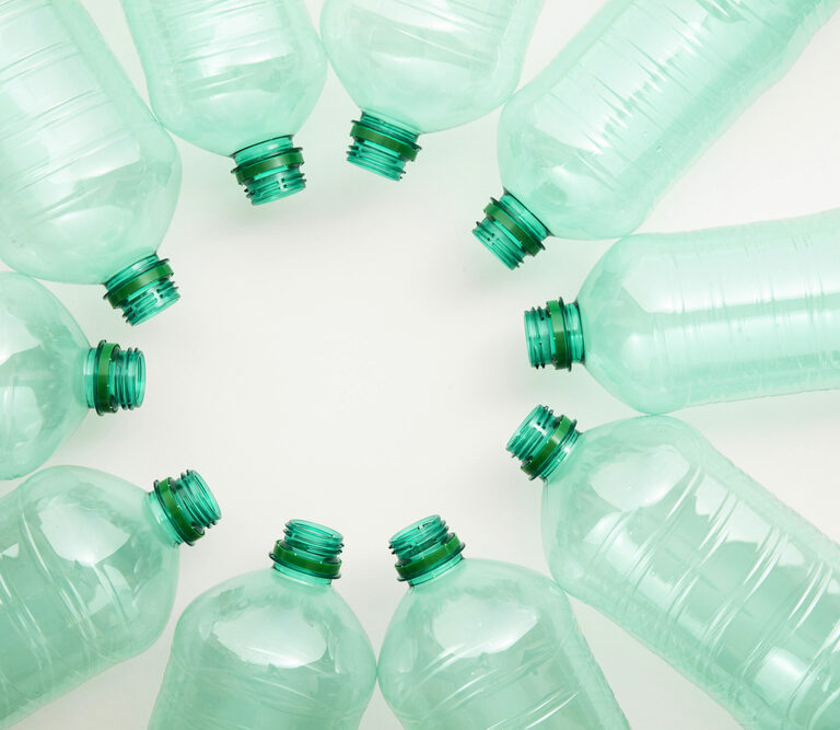 Empty used green plastic water bottles for recycling. environment concept